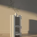 White Modern Side Table with Open Shelves Decorative Vase and Greenery Against Beige Wall