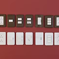 White and Brown Switch Panels with Various Switches and Sockets on Red Background 3d model