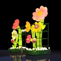 Vibrant Illuminated Event Gateway With Colorful Flower Decorations And Green Base