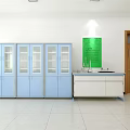 Laboratory Interior With Blue Glass Door Cabinets White Workbench And Green Wall Board
