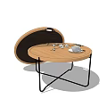 Modern Round Coffee Table With Wooden Top And Black Metal Legs Featuring Tea Set