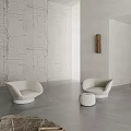 Modern Minimalist Living Room With White Walls Gray Flooring White Sofa And Black Table