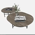 Modern Round Wooden Coffee Table With Black Metal Legs And Decorative Books Plant