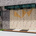 Outdoor Recreational Climbing Wall With Brick Wall Background Colorful Holds And Safety Mats