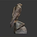 Lifelike Falcon Sculpture Perched on Natural Rock Base with Detailed Feather Texture