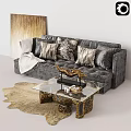 Elegant Gray Velvet Sofa With Decorative Pillows White Blanket Glass Coffee Table And Gold Accents