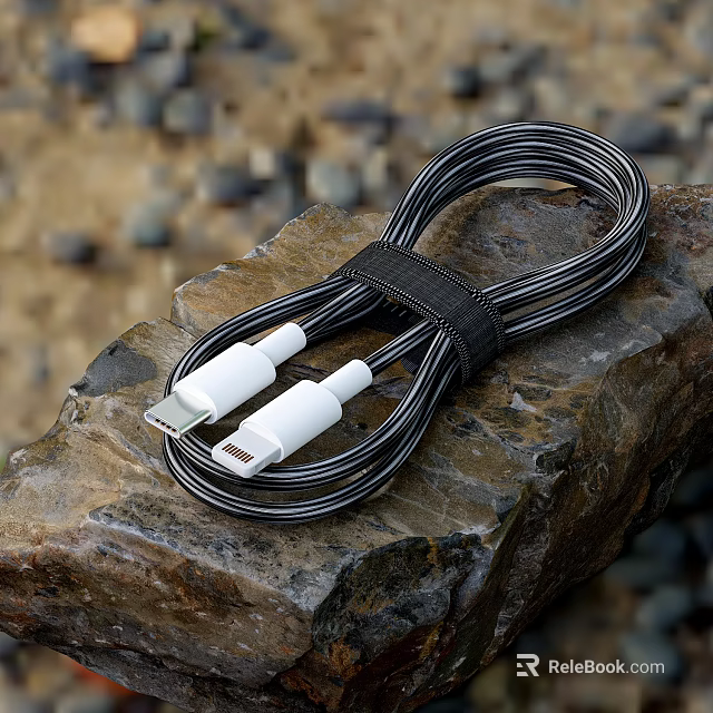 Braided Mobile Phone Data Cable With USB And Lightning Connectors On Rock Surface 3d model