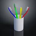 Four Colorful Toothbrushes In White Cup For Daily Hygiene Use
