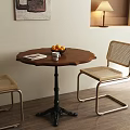 Wooden Round Dining Table Set with Rattan Chairs Metal Frame Wall Art and Table Lamp