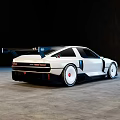 White Modified Sports Car Featuring Wide Body Rear Spoiler White Wheels In Empty Indoor Space