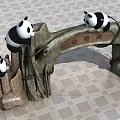 Zoo Entrance Gate With Panda Decorations On Stone Structure And Branch Accents