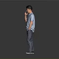 Man Wearing Blue Shirt And Jeans Talking On Phone With Black Cap Against Gray Background 3d model