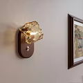 Diamond Shaped Modern Wall Sconce With Amber Glass Shade And Wooden Base On Light Wall