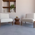 Accent Chairs Light Colored With Wooden Legs Small Round Table Potted Plant Books On Shelf