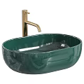 White Oval Vessel Sink with Black Faucet and Metallic Decorative Balls