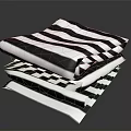 Stylish Black And White Striped And Checkered Bed Linens Stacked Neatly