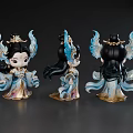 Three Chibi Style Game Movie Character Figurines with Blue Gold Feathered Wings and Ornate Costumes