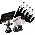 Red And White Striped Cups With Black Holder Coffee Maker And Stirrers On Countertop