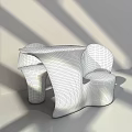 Modern Sculptural Table And Chair Set With Curved Shape And Dark Finish For Interior Decor