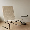 Modern Minimalist Leisure Chair With Woven Beige Fabric And Metal Frame By Side Marble Table