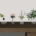 Different Shaped Glass Vases With Pink Flowers White Blooms And Greenery On Wooden Table