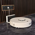 White Circular Robot Vacuum Cleaner With Charging Dock On Marble Floor In Modern Home