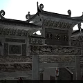 Traditional Chinese Village Archway With Ornate Carvings And Classic Curved Roofs