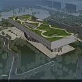 Modern Museum Building with Green Curved Roof Surrounded by Trees and Greenery