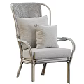 Stylish Rattan Leisure Chair With Armrests Light Colored Cushion And Geometric Pattern Pillow