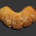Freshly Baked Golden Curved Bread With Sesame Seeds And Shiny Crust