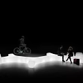 Illuminated Curved Landscape Seat Design With People Sitting And Chatting Outdoors