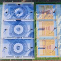 Aerial View Of Multiple Basketball Courts With Colorful Surfaces And Bleachers 3d model