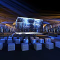 Modern Event Venue With Large LED Stage And White Cube Seats Under Blue Lighting