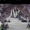 Elegant Banquet Hall With Purple Drapery Floral Decor Stage Steps And Chandeliers