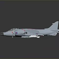 Light Gray Military Jet Model With Red Blue Markings And Weapon Attachments