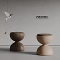 Poliform Rounded Top Stools In Dark And Light Wood With Hummingbird Decoration On Grey Wall