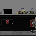 Retail Reception Desk With Computer Monitor Shopping Baskets Cart And Items