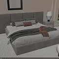 Modern Double Bed With Upholstered Headboard Gray Brown Pillows Layered Blanket And Nightstand Lamp