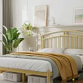 Modern Bedroom Interior with Golden Headboard White Sheets Yellow Blanket Green Plant and Decorative Paintings