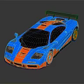 Sleek Blue And Red Sports Car With Black Rear Spoiler Red Wheels And Sporty Design