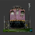 Toy Train Model With Black Steam Locomotive And Pink Car On Green Track