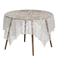 Elegant Round Dining Table With White Lace Tablecloth And Wooden Legs