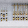 Gold And Black Metal Springs With Connectors On Wall Mounted Rack