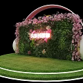 Stage With Headphone Shaped Arch Pink Flowers Green Plant Wall Neon Lights And Lawn Floor