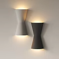 Twisted White and Black Wall Lamps Mounted on Wall Illuminating Surface