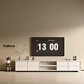 Modern White TV Stand With TV Decorations Plant And Stuffed Bear On Beige Wall