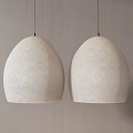 Two Beige Textured Oval Shaped Pendant Lights Hanging On Minimalist Wall