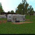 Silver Camper Van On Wooden Platform In Green Grassland With Trees Tent And Outdoor Chairs