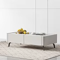 Modern White Coffee Table With Drawers And Fruit Plates Books On Top