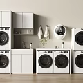 Modern Stacked Washing Machines In Laundry Room With White Cabinets And Towels
